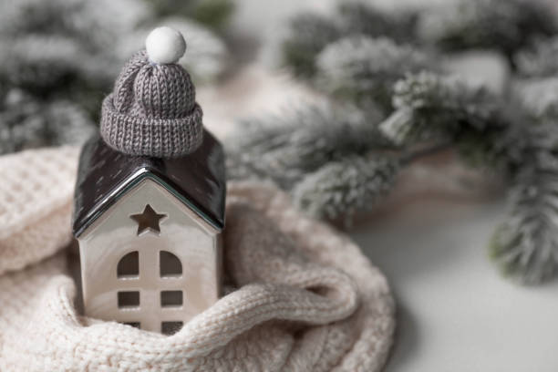 istock A house wrapped in a scarf. Winter. Home insulation, protection from cold and bad weather, room heating system. The energy crisis in Europe. Festive mood, Christmas, New Year 2023 1440253473