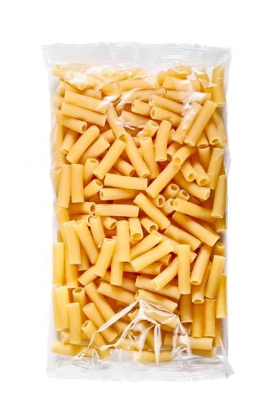 istock Penne pasta in plastic package isolated on white background. 1440253815
