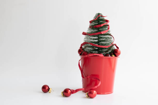 istock Little Christmas Tree on White background 1440254707