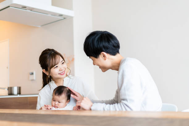 istock Happy families with healthy babies 1440254845