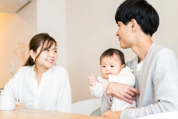 istock Happy families with healthy babies 1440255025