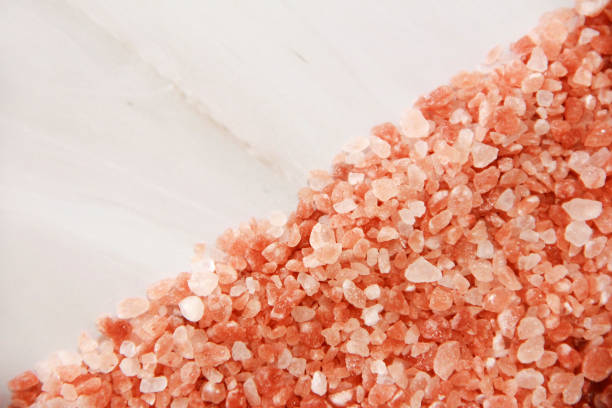 istock small granules of pink Himalayan salt on a gray marble background 1440257873