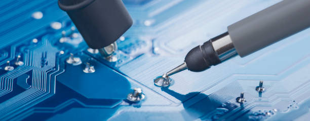 istock Measuring electronic signal using oscilloscope on the PCB. Electronics repair and digital technology. 1440258591