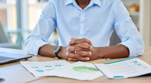 istock Businessman hands, paperwork data graphs and planning annual report, research and office budget. Closeup of marketing documents, strategy chart and analytics progress with financial economy stats 1440260117