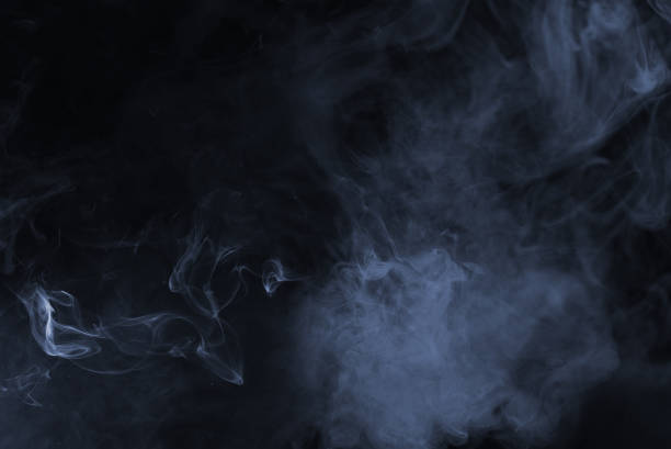 istock Blue and pink steam on a black background. 1440261560