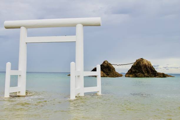 istock Selective shot of a Japanese white gate in Itoshima beach with cliffs visible in the background 1440262160
