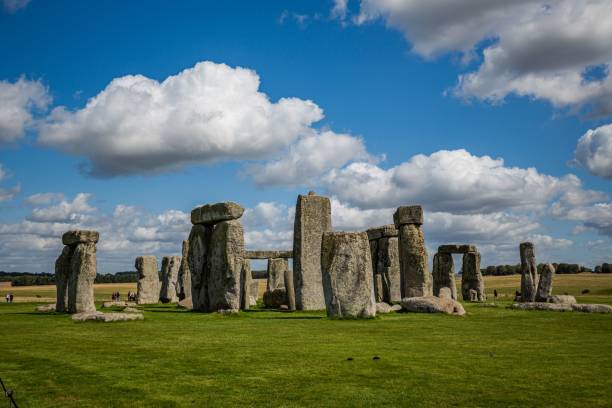 istock Stonehenge in the green meadows with a cloudy blue sky 1440262459