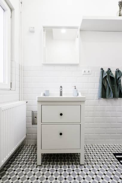 istock Little white drawer in a white bathroom with hygiene care items on it 1440262650
