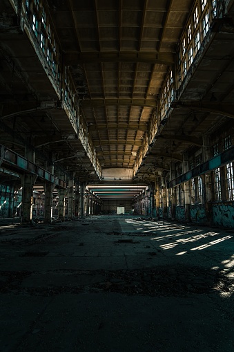 The indoors of an old large abandoned facility