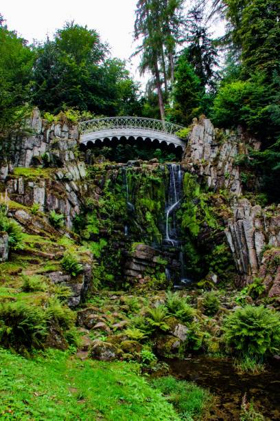 istock lovely bridge over waterfalls 1440263984