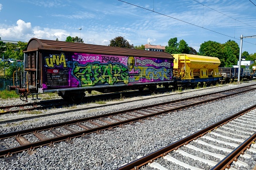 Nyon, Switzerland – September 01, 2022: A train wagon with graffiti art on a sunny day