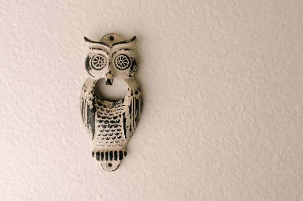 istock Owl mask on a white brick wall. 1440265940