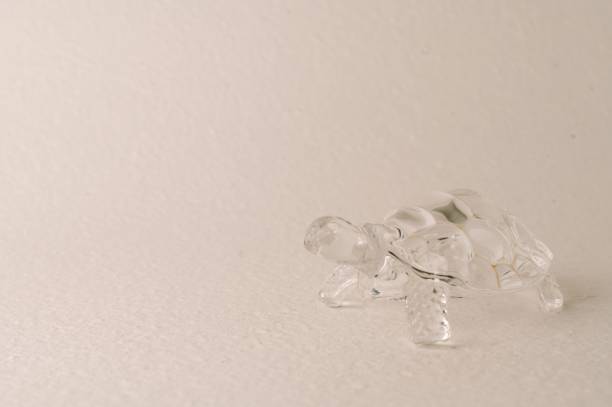 istock Glass sea turtle on bright background. 1440265955