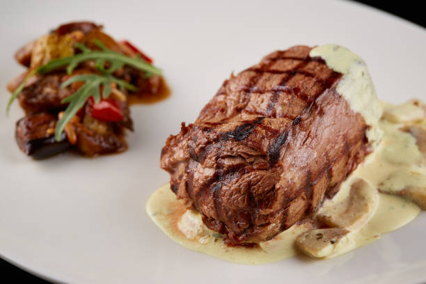istock Rib eye steak with melted cheese 1440267322
