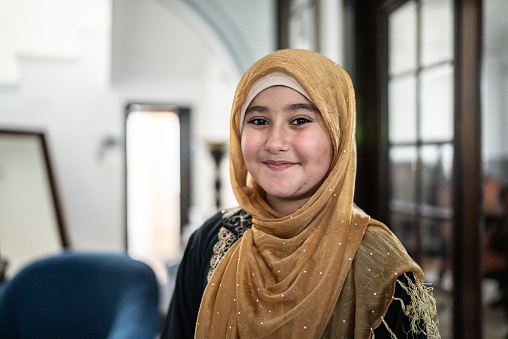 Portrait of a cute islamic girl at home