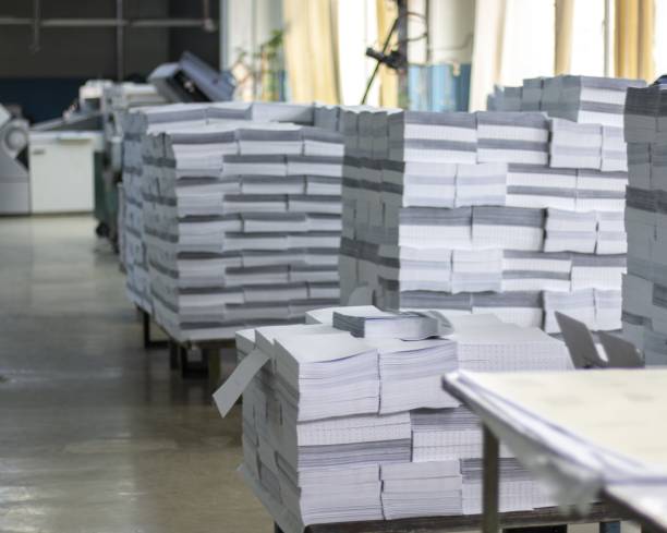 Paper factory Paper factory machinery with workers manufacturing sourcing stock pictures, royalty-free photos & images