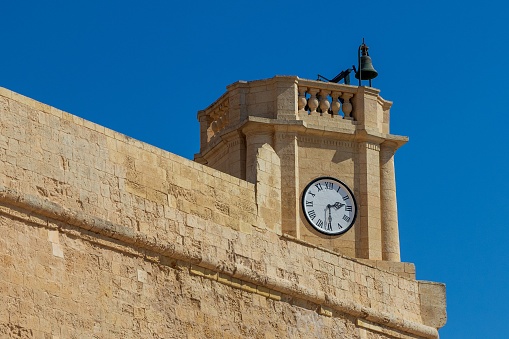 The clock and bell at the Cathedral of the Assumption in the Cittadella of Victoria in Gozo, Malta