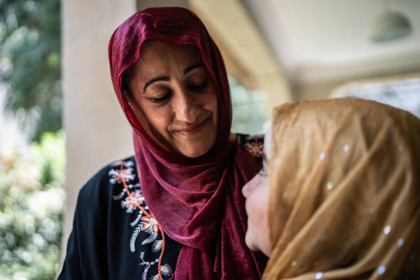 istock Proud mother looking at daughter 1440268519