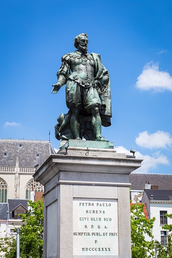 A vertical shot of the beautiful statue of Peter Paul Rubens against a blue sky in Antwerp, Belgium