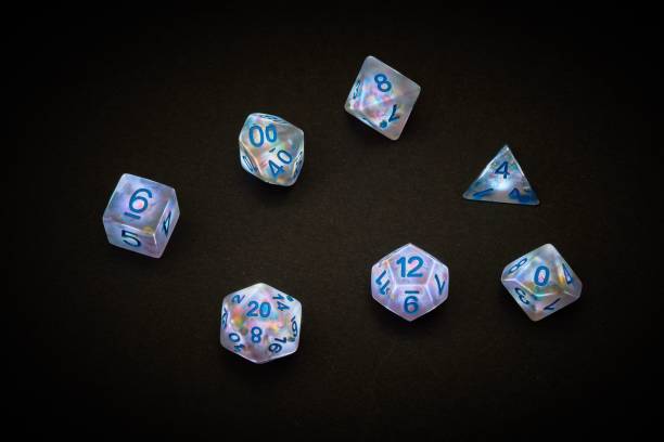 Closeup shot of a standard set of seven transparent polyhedral  used for tabletop games A closeup shot of a standard set of seven transparent polyhedral  used for tabletop games developing 8 stock pictures, royalty-free photos & images