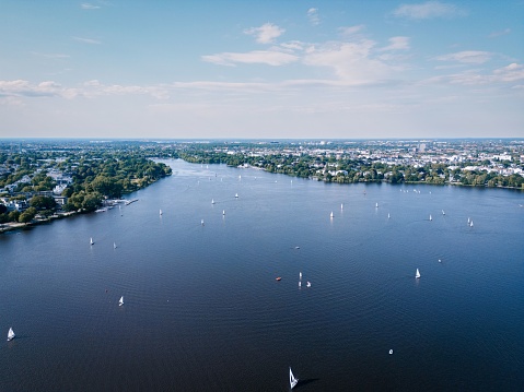 Aerial view of boats sailing on the Outer Alster Lake on a sunny day in Hamburg