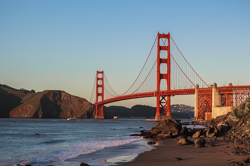 Beautiful shot of The Golden Gate Bridge with clear blue sky and the lake