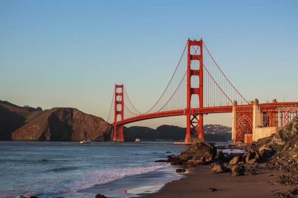 Beautiful shot of The Golden Gate Bridge Beautiful shot of The Golden Gate Bridge with clear blue sky and the lake symbols of california stock pictures, royalty-free photos & images