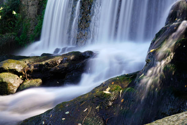A mountain stream flows down the stones. Natural background.