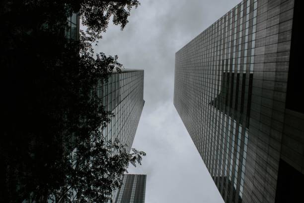 istock Two tall buildings facing each other shot from a low angle 1440271780