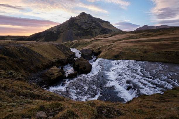 istock Skogafoss Waterfall with a cloudy sky and mountains in the background, Iceland 1440272095
