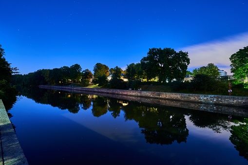 A scenic view of the Aura river passing through the city of Turku during nighttime