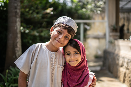 Portrait of happy islamic siblings