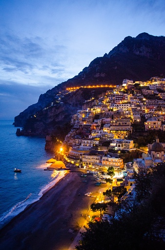 A beautiful vertical shot of the village of Positano in Italy during evening time