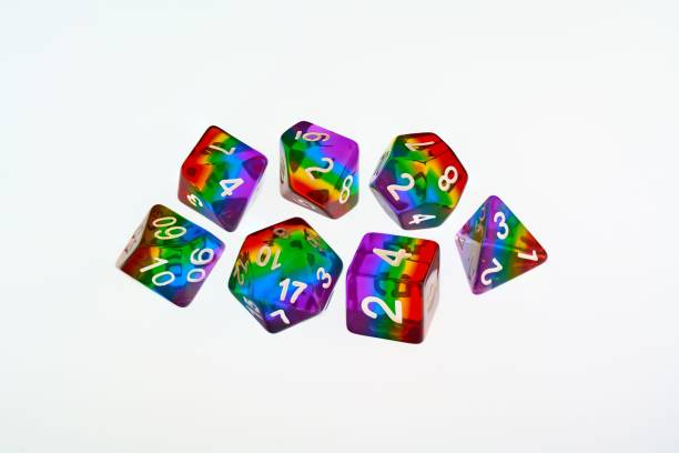 Rainbow dice illustrating the concept of LGBTQ representation and inclusion in tabletop RPG gaming A set of 7 dice used for role playing games which have recently seen an increase in representation and inclusion of diverse players developing 8 stock pictures, royalty-free photos & images