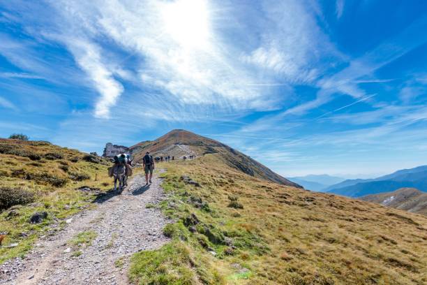 beautiful shot of people hiking in the mountains of mercantour national park in france - mercantour national park imagens e fotografias de stock