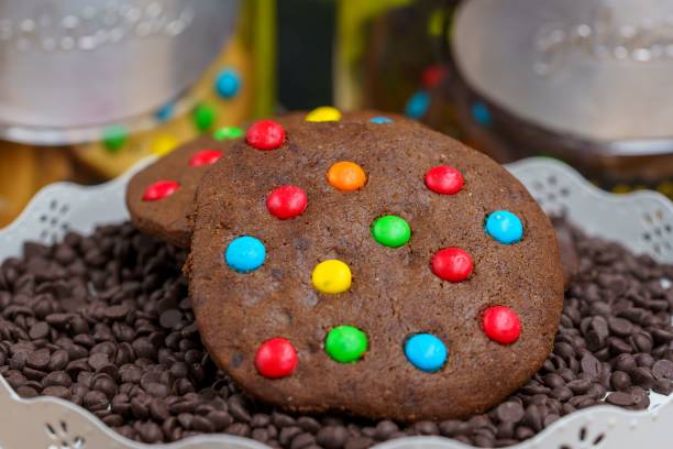 istock A multi-colored chocolate cookie Homemade on a bed of chocolate chips 1440273833