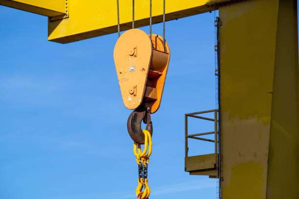 istock gantry crane with hook against blue sky 1440273836