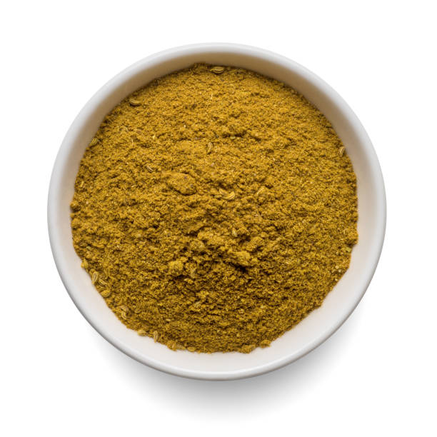 istock Curry powder in round bowl isolated on white. Top view. 1440274831