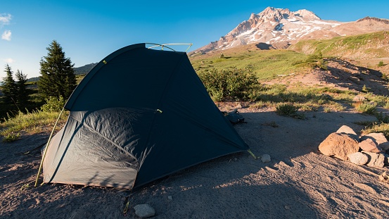 A large black tent on Mount Hood in Oregon on a sunny day