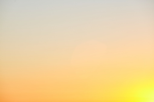 A breathtaking shot of the golden sunset sky over the Pacific Ocean - perfect for a background wallpaper