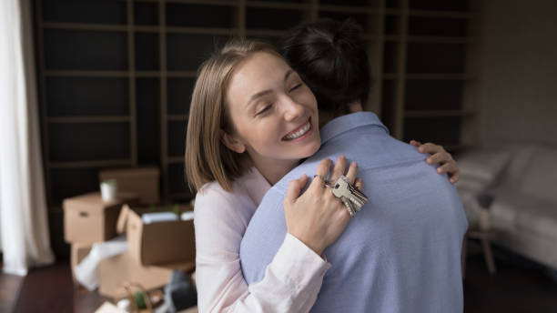 istock Loving wife and husband hugging on relocation day 1440276536