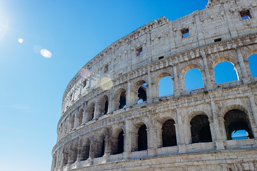 A closeup shot of the famous historic Colosseum under the clear sky in Rome, Italy