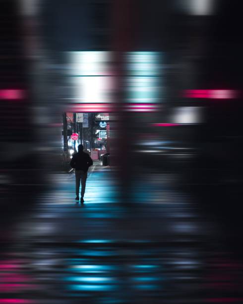A edited image of a man walking on a sidewalk. By adding the motion blur effect it looks like a science fiction movie scene