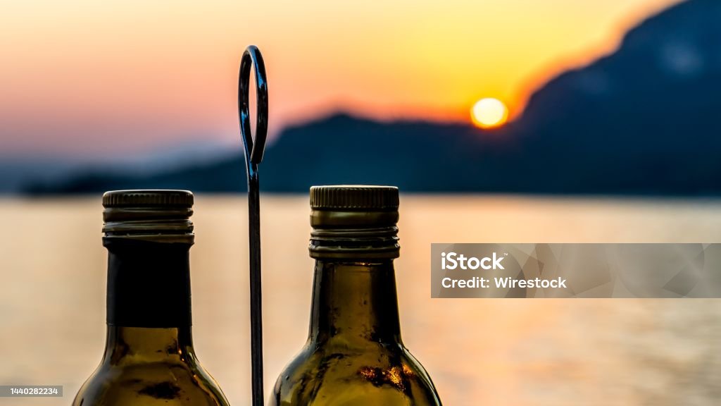 Sunset with olive oil and vinegar in Italy Sunset with olive oil and vinegar Garda Italy Color Image Stock Photo