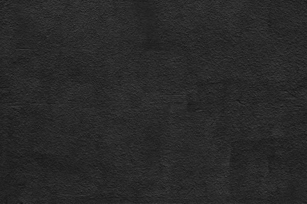 istock Black rough plaster surface texture. Textured shabby messy wall. Dark grunge background 1440283211