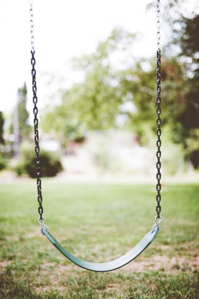 istock Vertical shot of a swing with a blurred background 1440283360