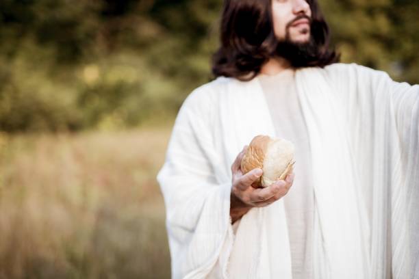 istock Jesus Christ giving out the sliced bread 1440284843