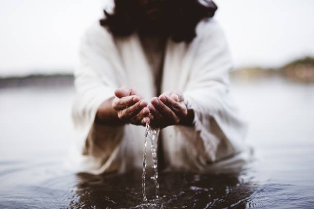 Biblical scene - of Jesus Christ drinking water with his hands A biblical scene - of Jesus Christ drinking water with his hands christ the redeemer stock pictures, royalty-free photos & images