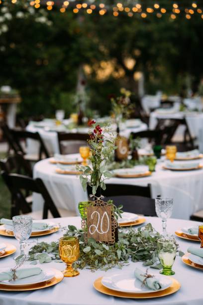 istock Vertical selective focus shot of a wedding table decorated with flowers 1440286383