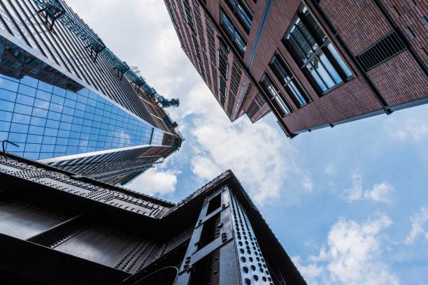 istock Low angle shot of high buildings with modern architecture patterns 1440286431